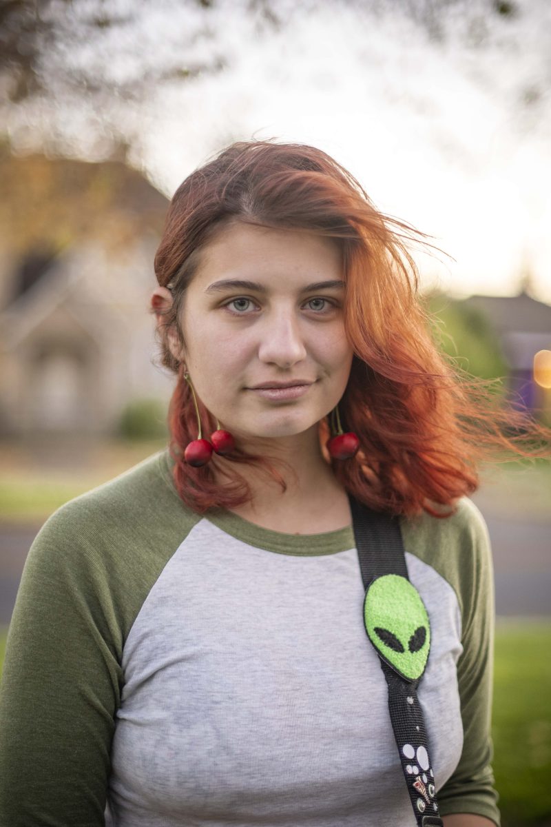 Kiki Parrosien, the lead guitarist with Laundry, wears her signature on-stage accessory: an alien patch attached to her guitar strap. Playing music is Parrosien&#8217;s favorite pastime.&#160;Photo by Meg Matsuzaki&#160;