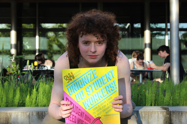 Will Garahan, standing in front of Global Scholars Hall, represents the voice and hope for the University of Oregon student workers as they push towards unionization across campus.