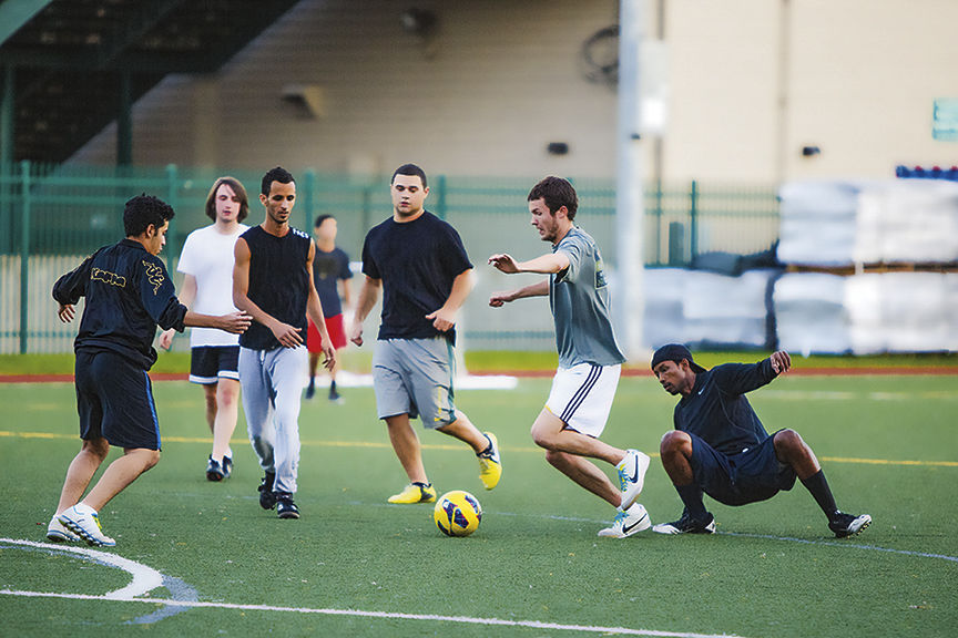 On Mondays through Thursday nights the same group of guys come together to play pick-up games of soccer.