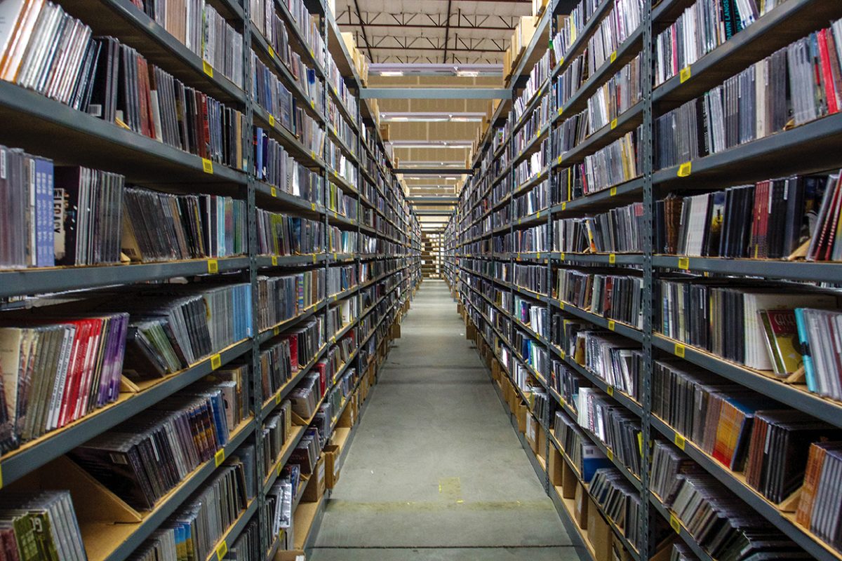 <p>Seemingly endless rows line CD Baby’s warehouse in Portland, Oregon. These rows archive music that has been, or will be, distributed by the label.</p>