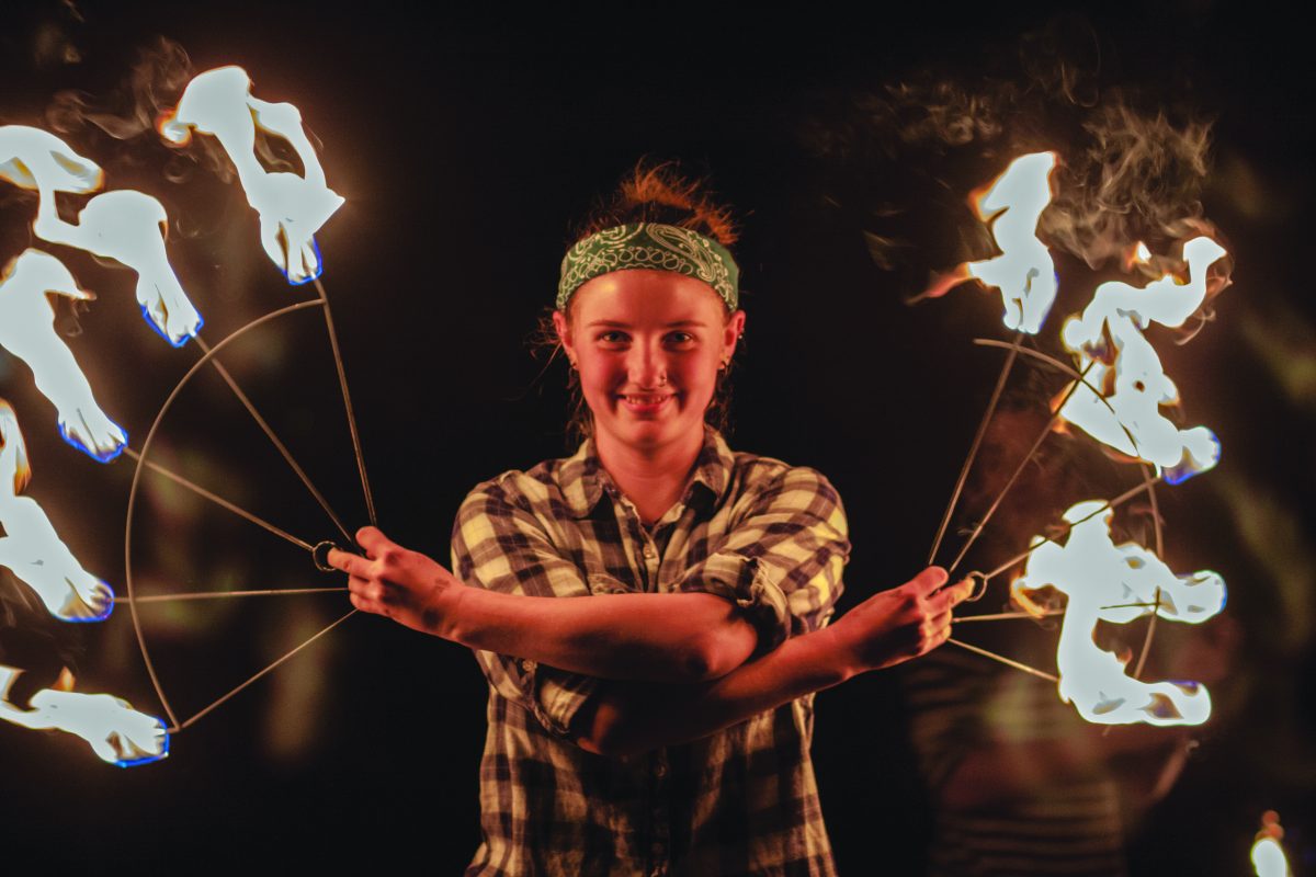 LeeAnn Sturrock says that her favorite part of performing with fire is watching the surprise and amusement on people&#8217;s faces. She has been doing it since she was in the 6th grade, so to her the moves are basic and simple, but when people are watching she is reminded of what it was like for her to watch fire dancing for her first time.