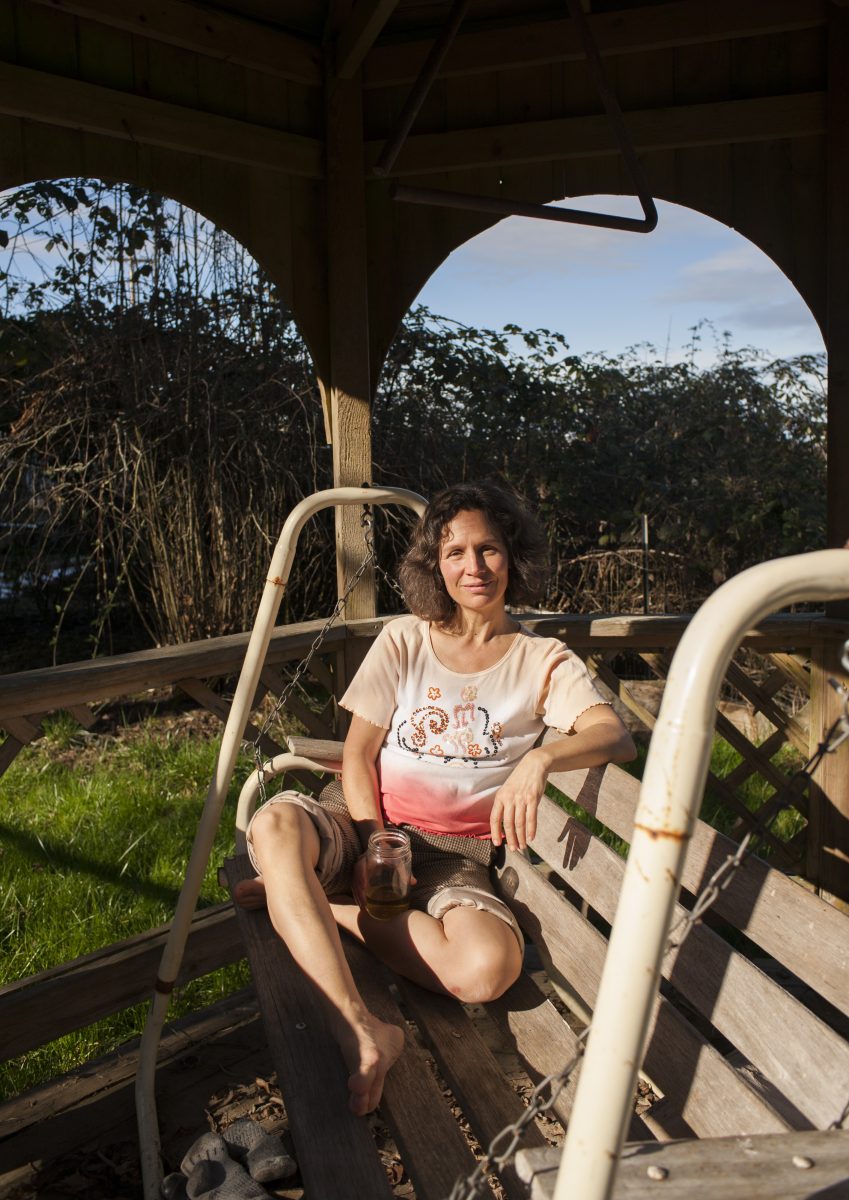 Joanna Castro lounges under a gazebo in the children&#8217;s play area of Heart-Culture farm community.