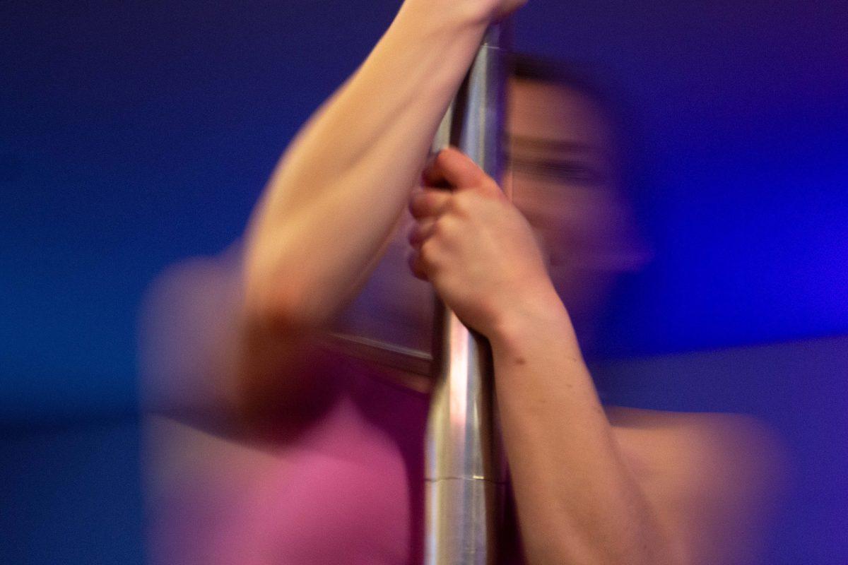 A model swings on a dancing pole. According to Centre for Social Connectedness, a non-profit focused on building social connections, sex work is often stigmatized as disgraceful. This social stigma was born in how the law treats sex work, according to the Centre.