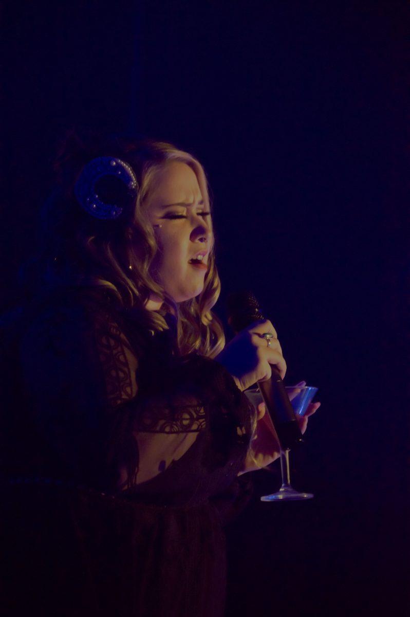 Erika Stalcup pours her heart into her rendition of Blue Moon, a popular ballad that dates back to 1934. The audience watches with awe, and her long belts are met with shouts and applause. Stalcup is using this performance to heal after serving as a volunteer firefighter during the Cedar Creek Fire. &#8220;To have something fun like this to look forward to after that traumatic experience is awesome for me,&#8221; she says.