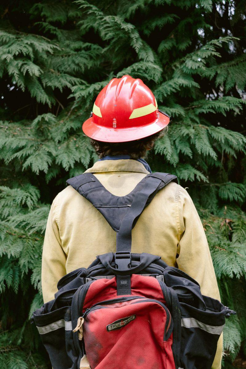 Trefny poses in his wildland firefighting gear in Eugene, Oregon on the UO campus.&#160;