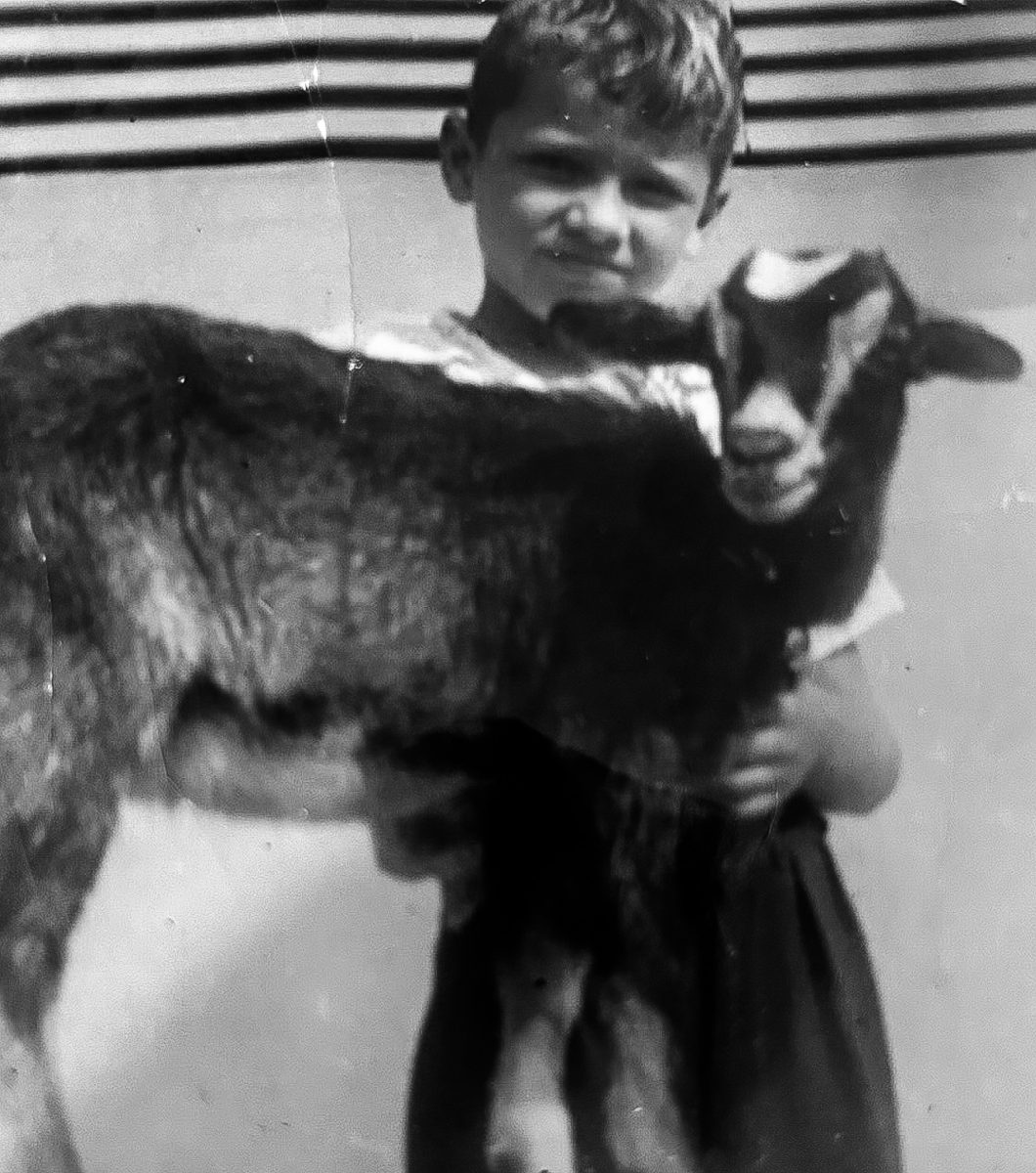 [Photo Courtesy of the Lara Family]

Ruben embraces his beloved childhood goat, Katrina.